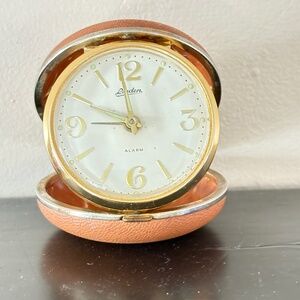 Vintage Landen travel clock; leather case; round